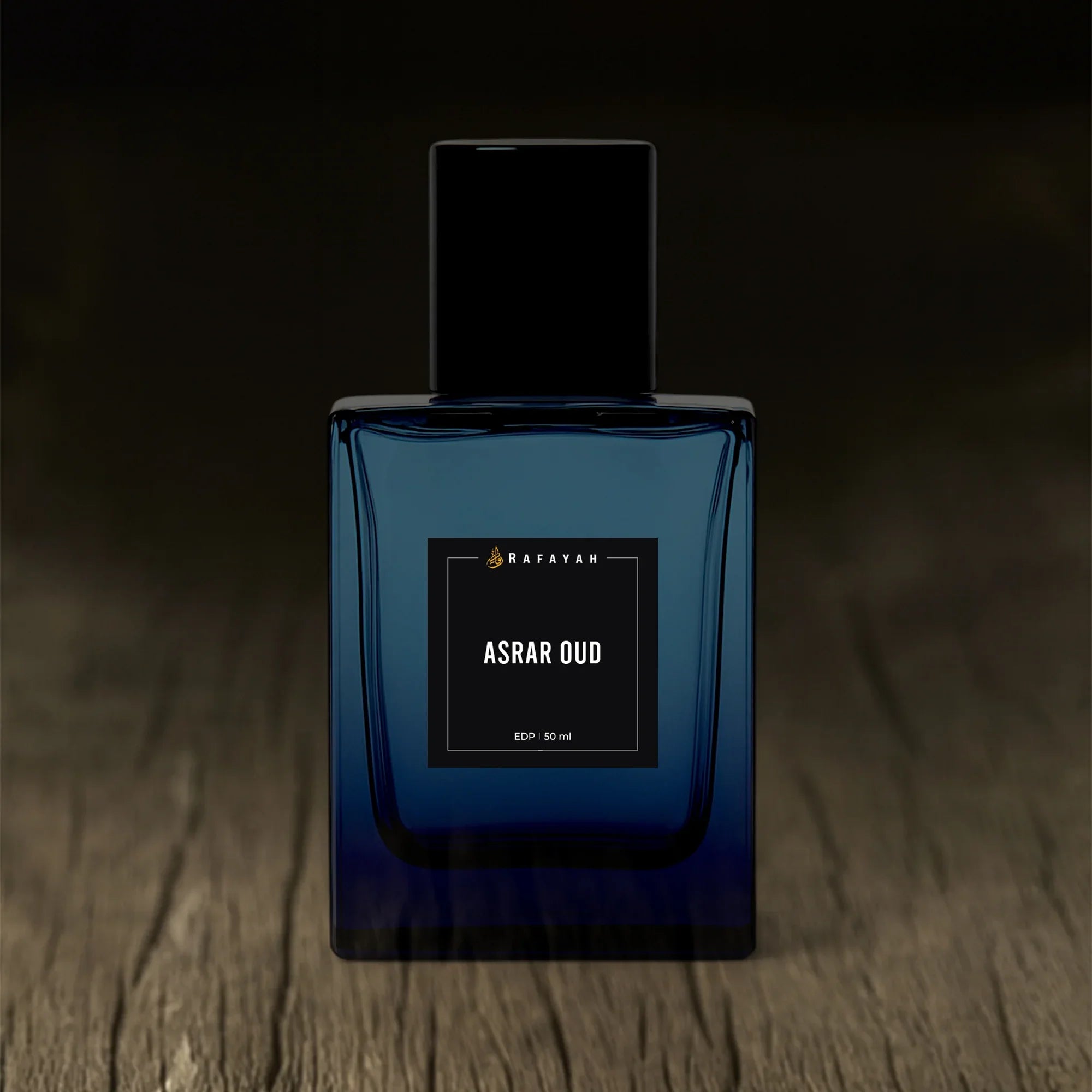 Rafayah Asrar Oud perfume bottle on wooden surface, luxury fragrance packaging