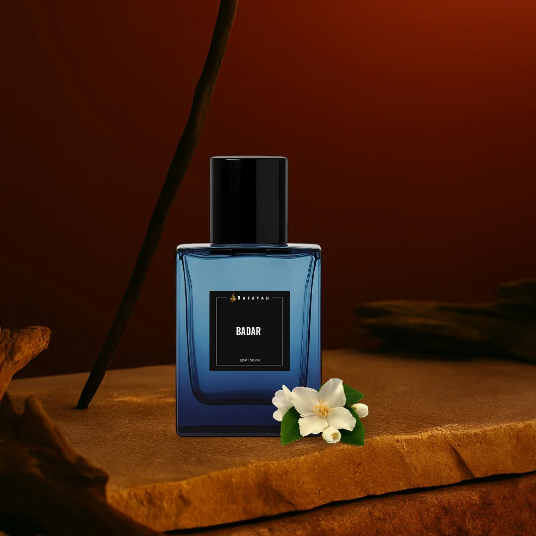 Badar perfume bottle with black cap on stone surface, white jasmine flowers, warm brown background