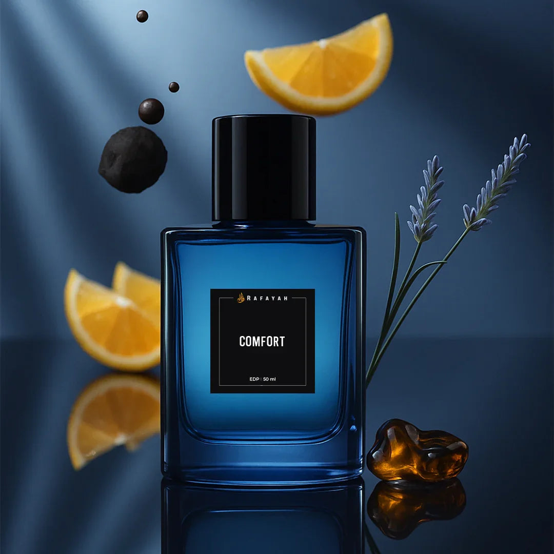 Blue Rafayah Comfort perfume bottle with orange slices, lavender, and amber on a dark background