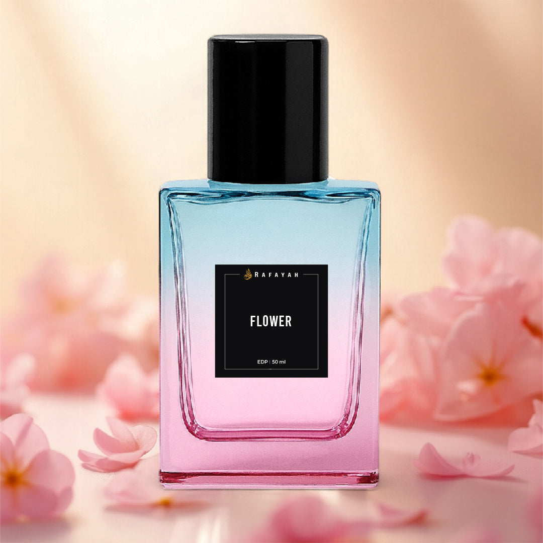 Gradient pink and blue perfume bottle labeled Flower by Rafayah with pink blossoms