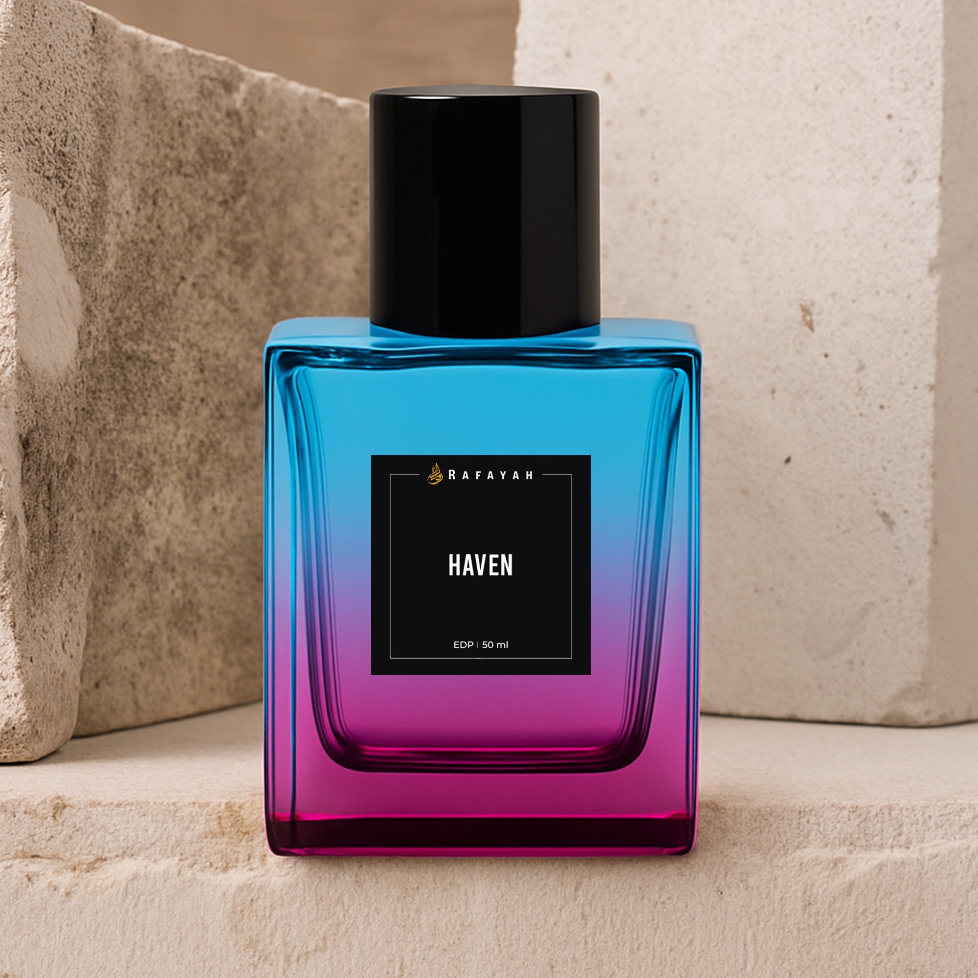 Rafayah Haven perfume bottle with blue and pink gradient glass on stone background