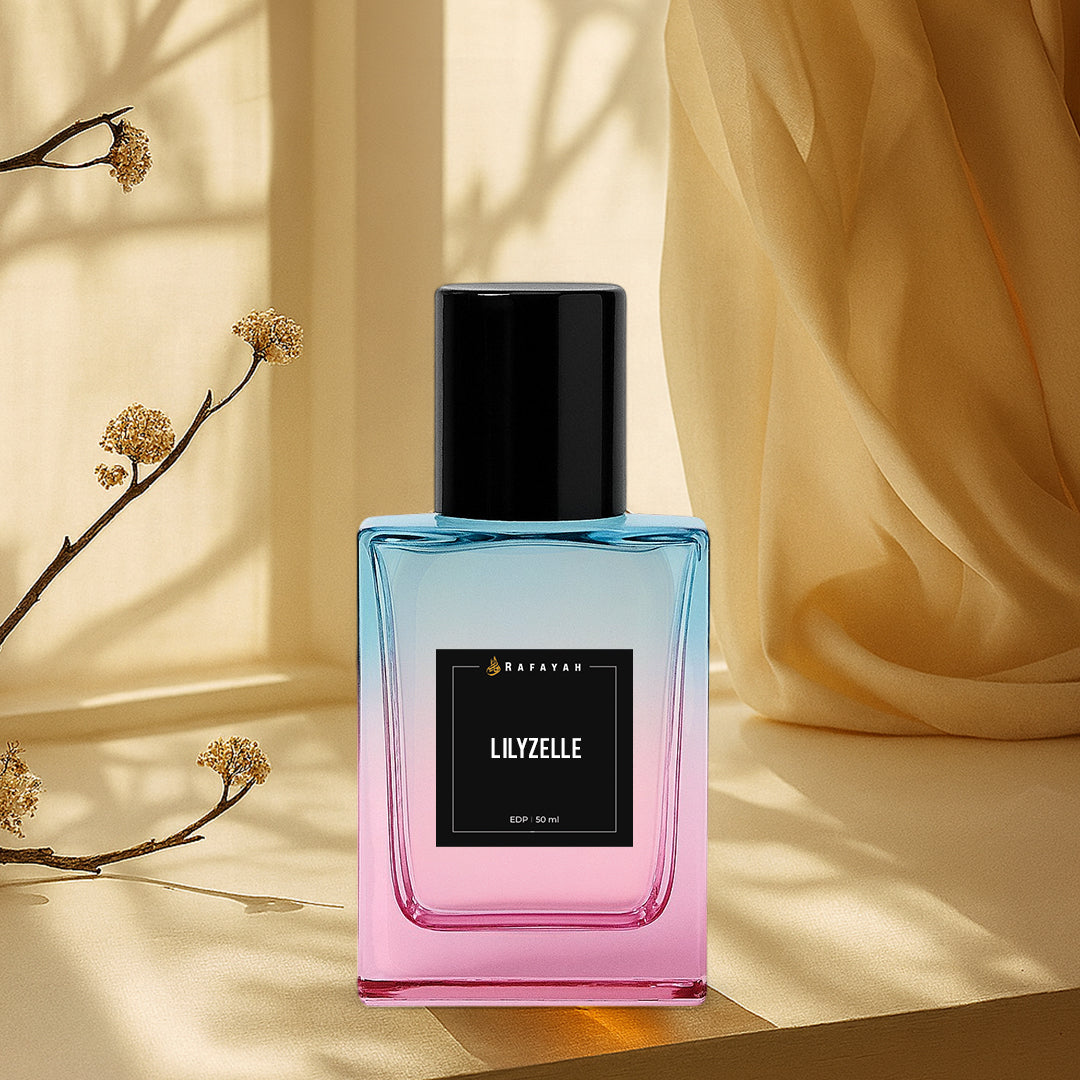 Lilyzelle perfume bottle with blue-pink gradient glass on beige fabric background with branches.