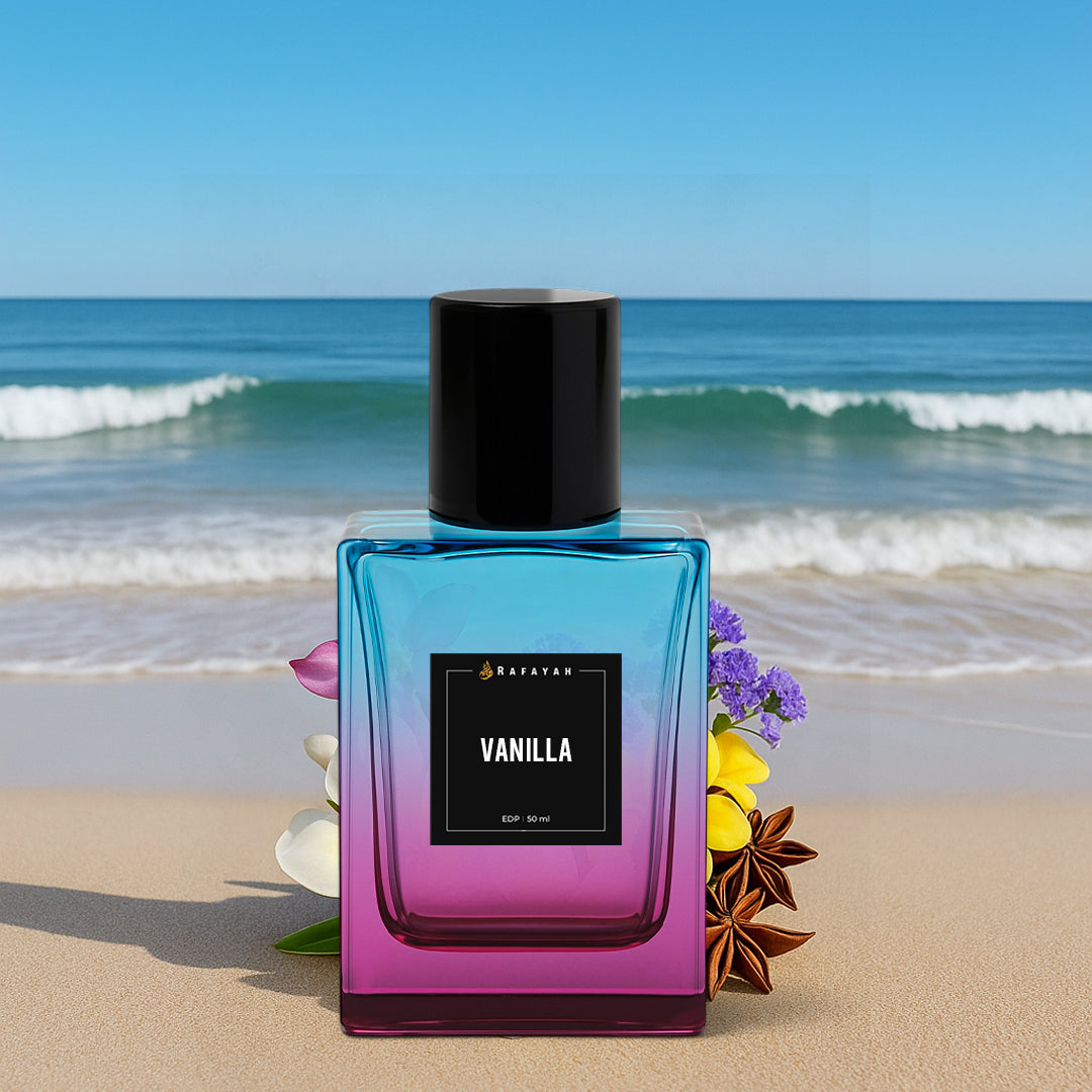 Rafayah Vanilla perfume bottle on sandy beach with flowers and ocean waves in background