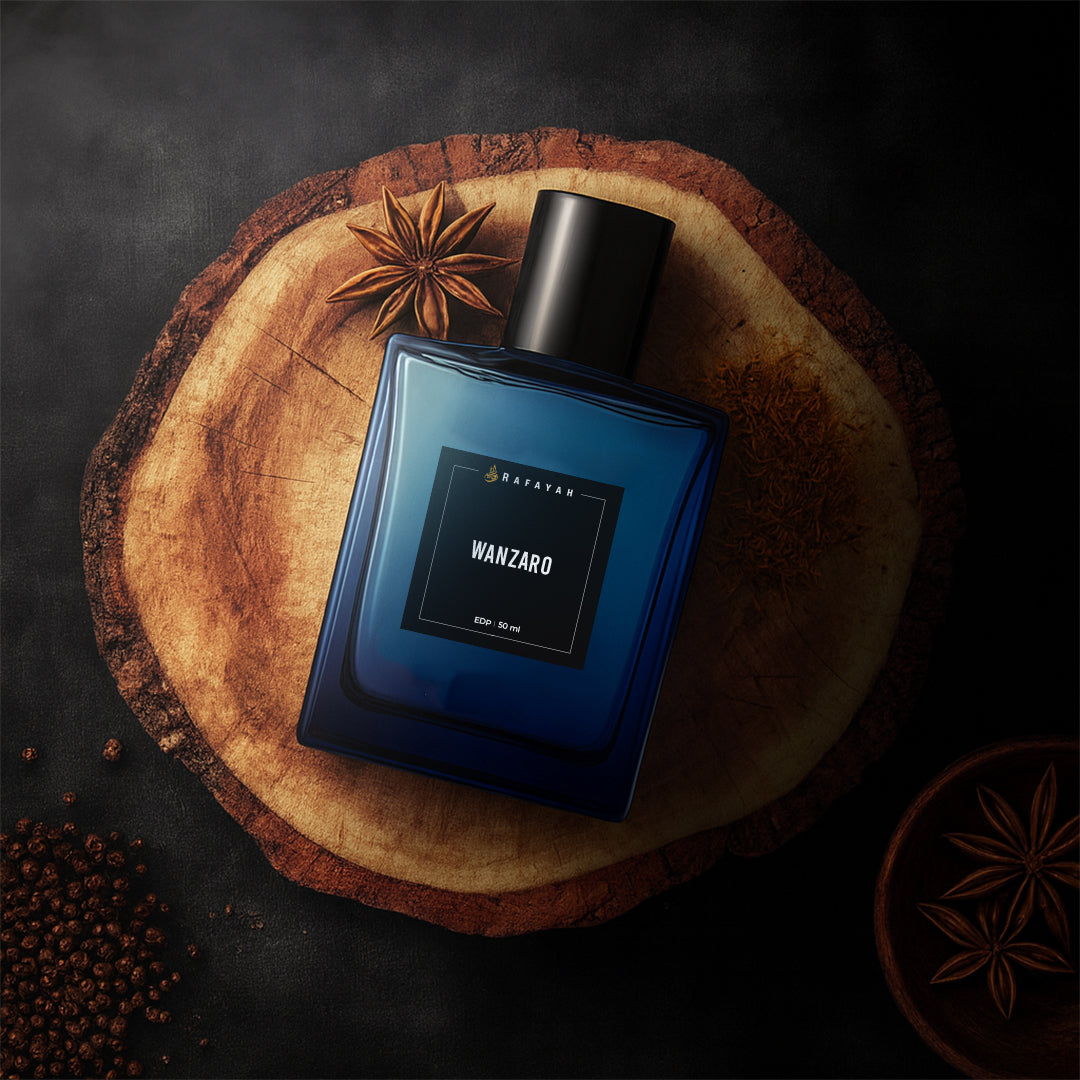 Wanzaro blue perfume bottle on wooden board with star anise and peppercorns, fragrance concept